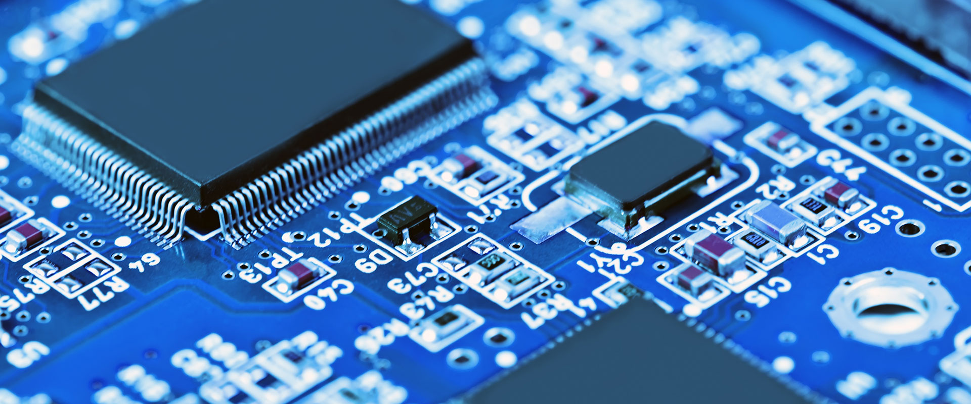 A zoomed in shot of a blue circuit board